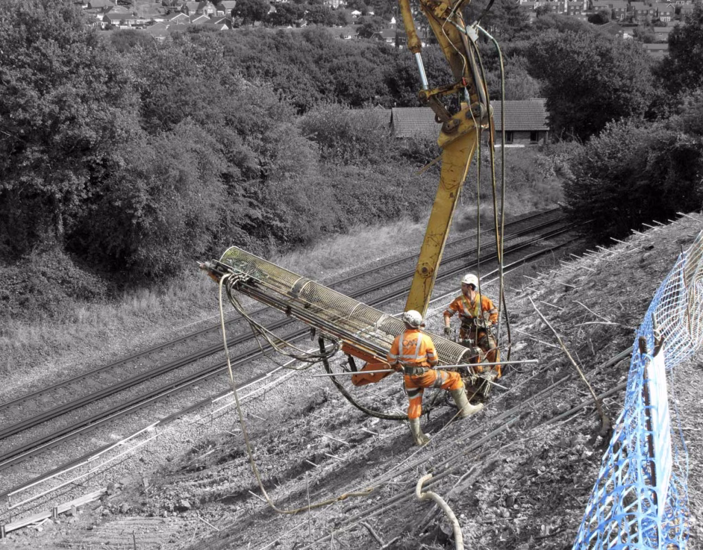 2 workers with a nailing machine