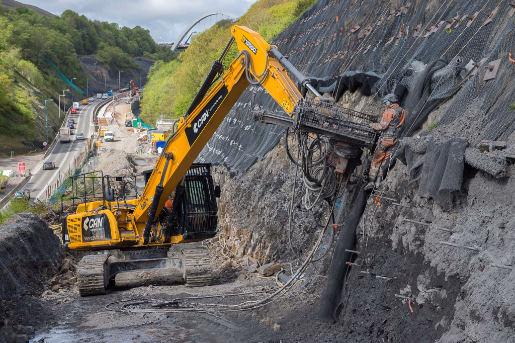 Heavy machinery working on a hillside.