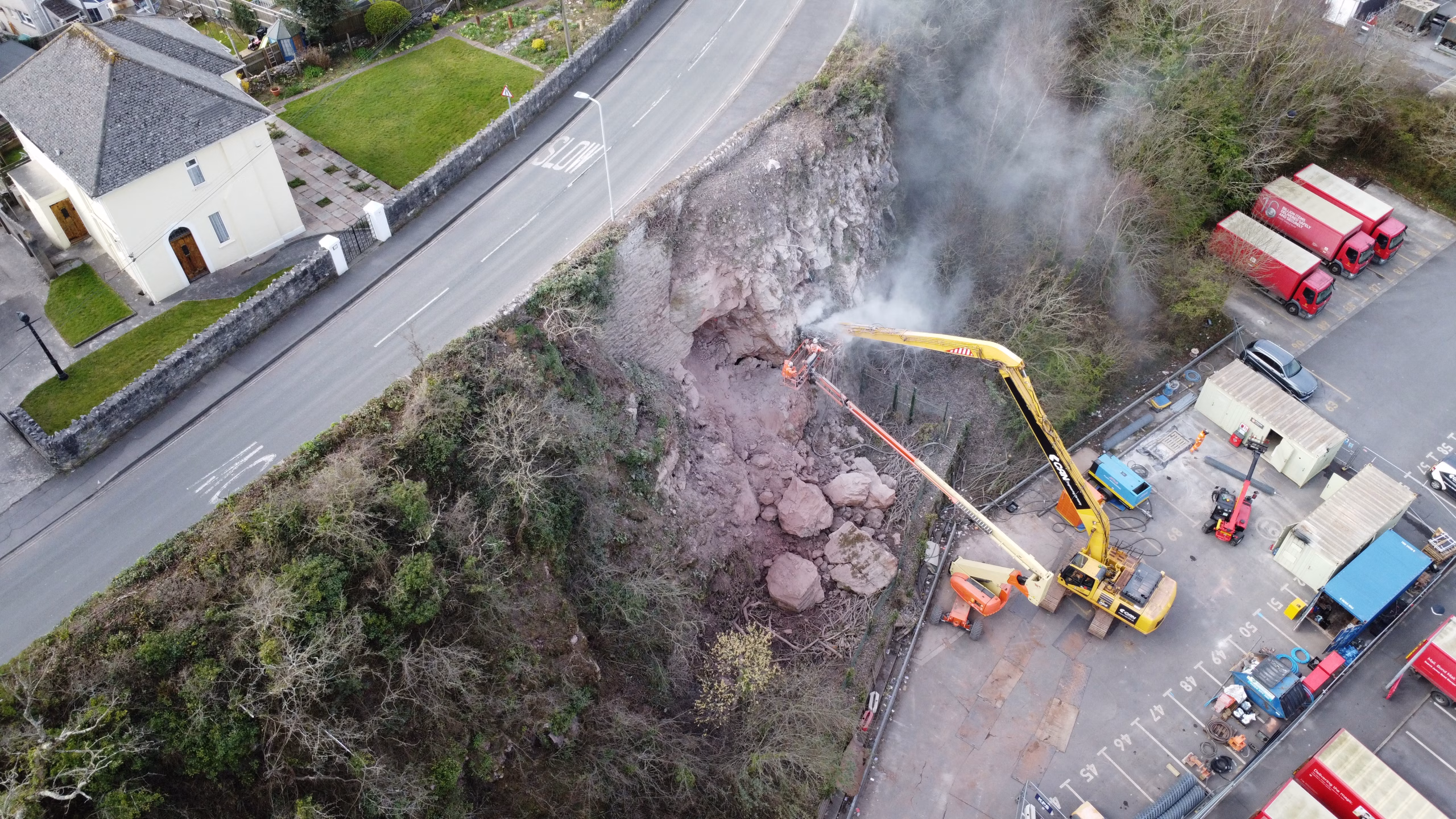 CAN team members removing a rock that may endanger a industrial facility.