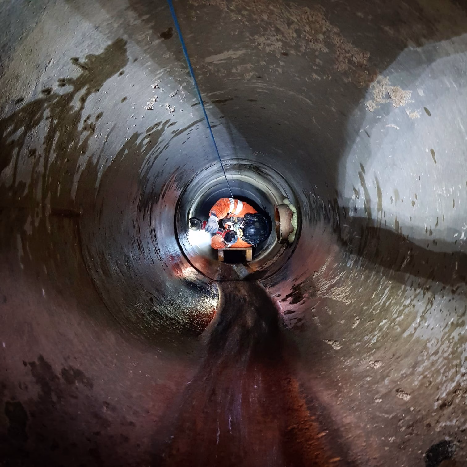 Worker in a pipe