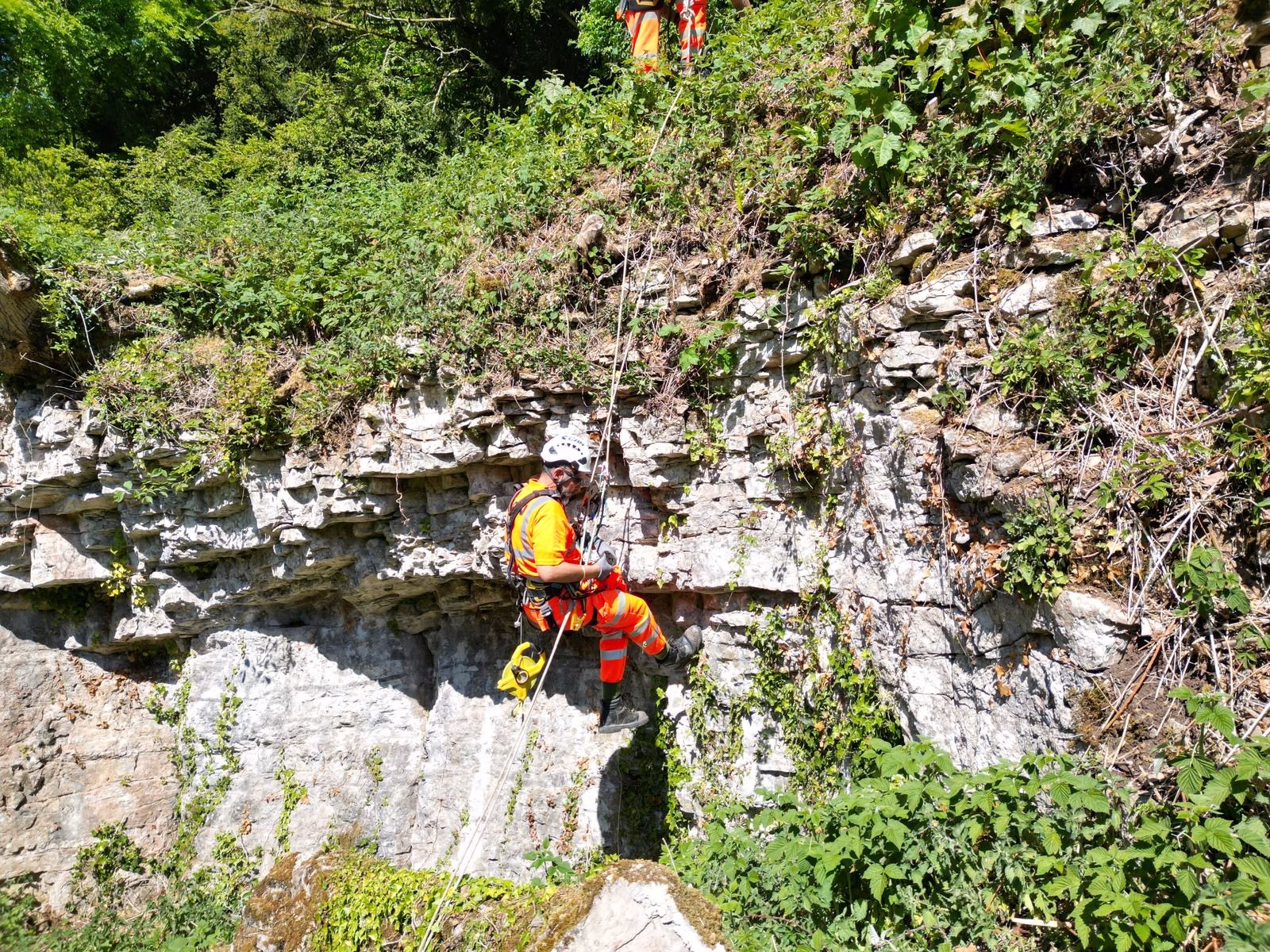 Working inspecting on a cliff side