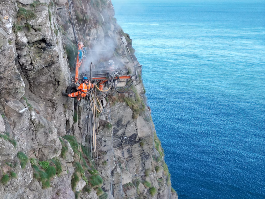 Rock bolt installation on cliff face